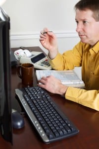 Accountant helping the embroidery coach